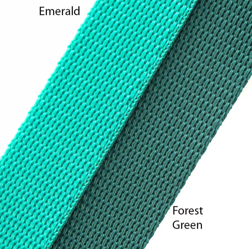 Color swatch comparison between Emerald and Forest Green on a textured background.
