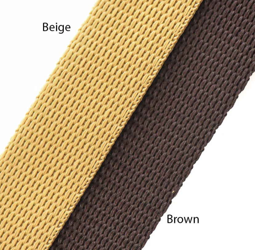 Close-up of beige and brown woven straps on a white background