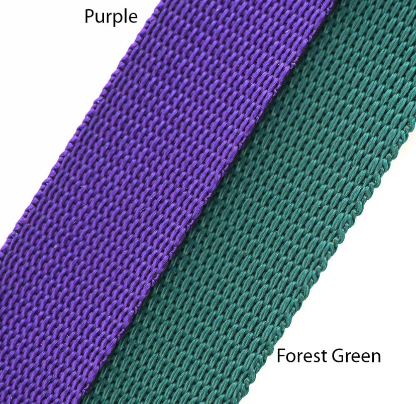 Close-up of purple and forest green webbing straps on a white background